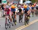 As they get the bell for the final lap, Lex ALBRECHT and Leah Kirchmann (Optum p/b Kelly Benefit Strategies) discuss tactics with Shelley OLDS  (Garage Racing) close behind. 		CREDITS:  		TITLE:  		COPYRIGHT: